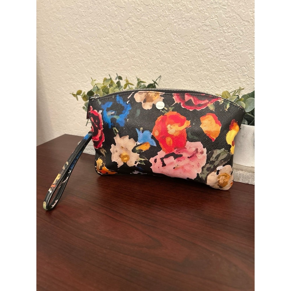 Lodis zippered pouch featuring a colorful floral pattern